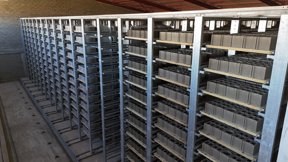 Hollow blocks curing on storage racks