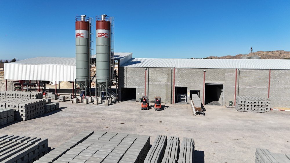 Product yard with stacked blocks and forklifts